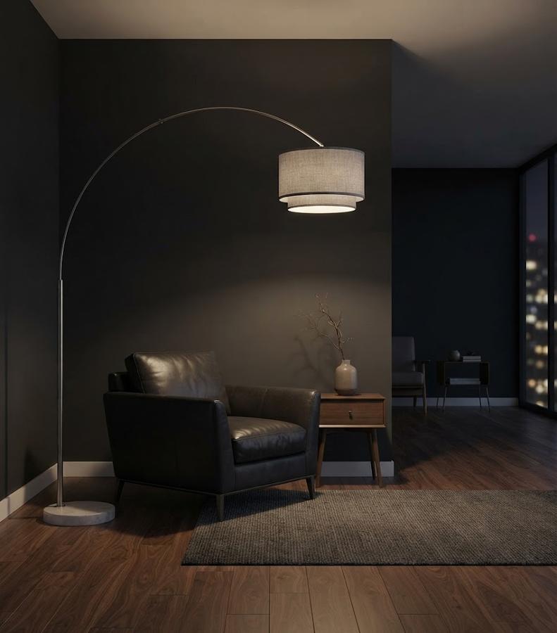 Marble lamp base on a wood floor beside a sofa leg